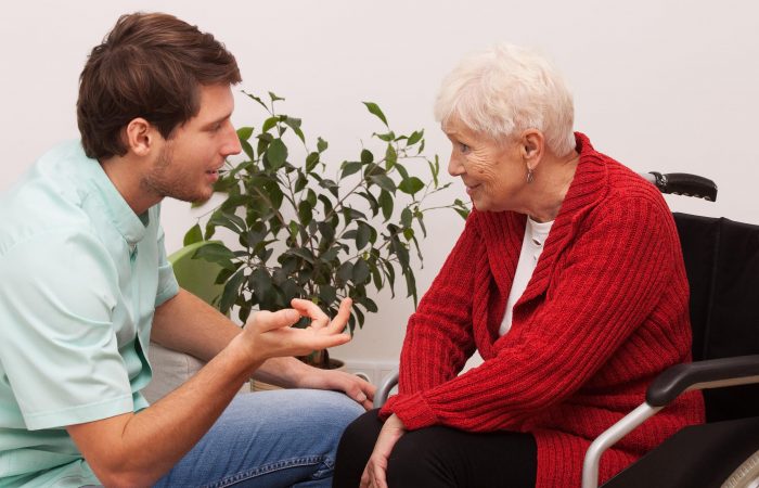 Nurse keeping company to disabled elderly lonley person