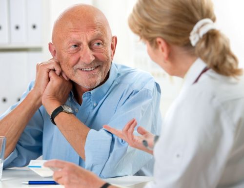15472824 - doctor talking to her male senior patient at office